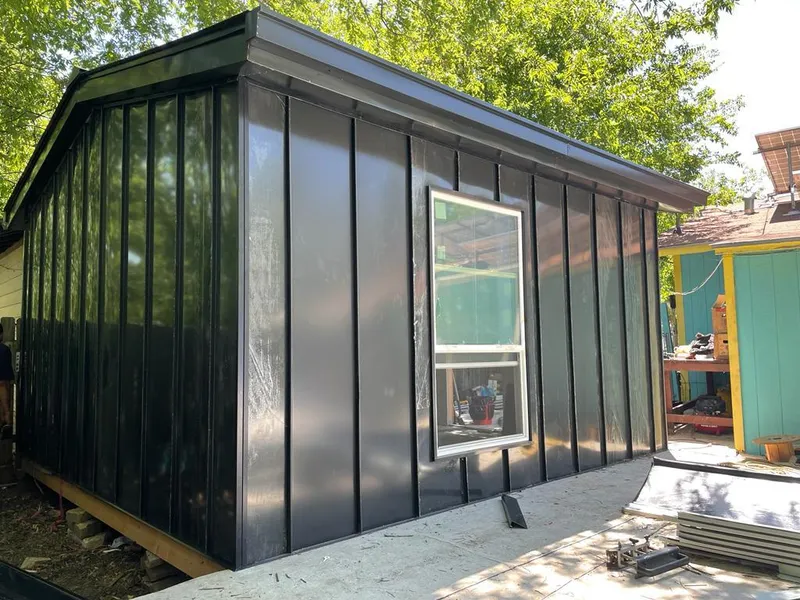 Black standing seam metal wall panels for Roof Inspection in Westchase